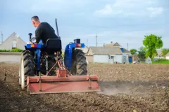 a-farmer-on-a-tractor-cleans-the-field-after-harve-2023-11-27-05-22-41-utc